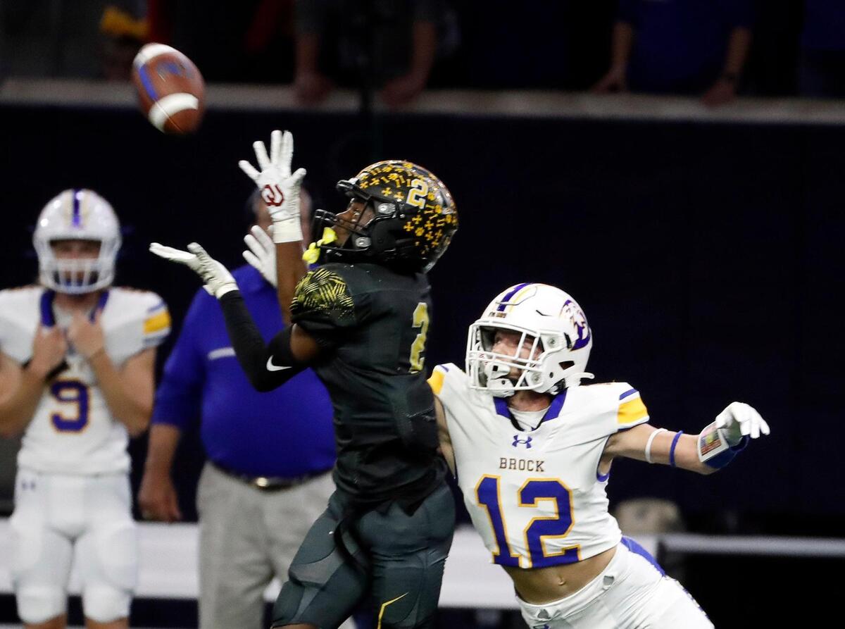 Malakoff defensive back Chauncey Hogg (2) steps in front of Brock wide receiver Cannon Stephens (12) for the interception in the first half of a UIL Class 3A D1 state semifinal football game at the Ford Center in Frisco, Texas, Thursday, Dec. 08, 2022. Brock led Malakoff 14-3 at the half. (Special to the Star-Telegram Bob Booth)
