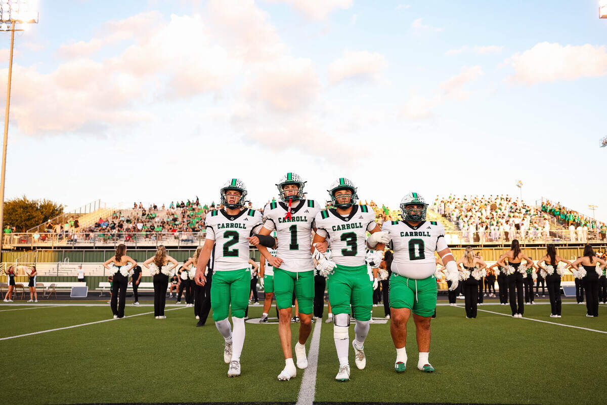 Southlake Carroll captains walk-out to midfield for the coin toss before a district matchup against Keller Timber Creek on Thursday, September 25, 2025 at Keller ISD Stadium in Keller, Texas.