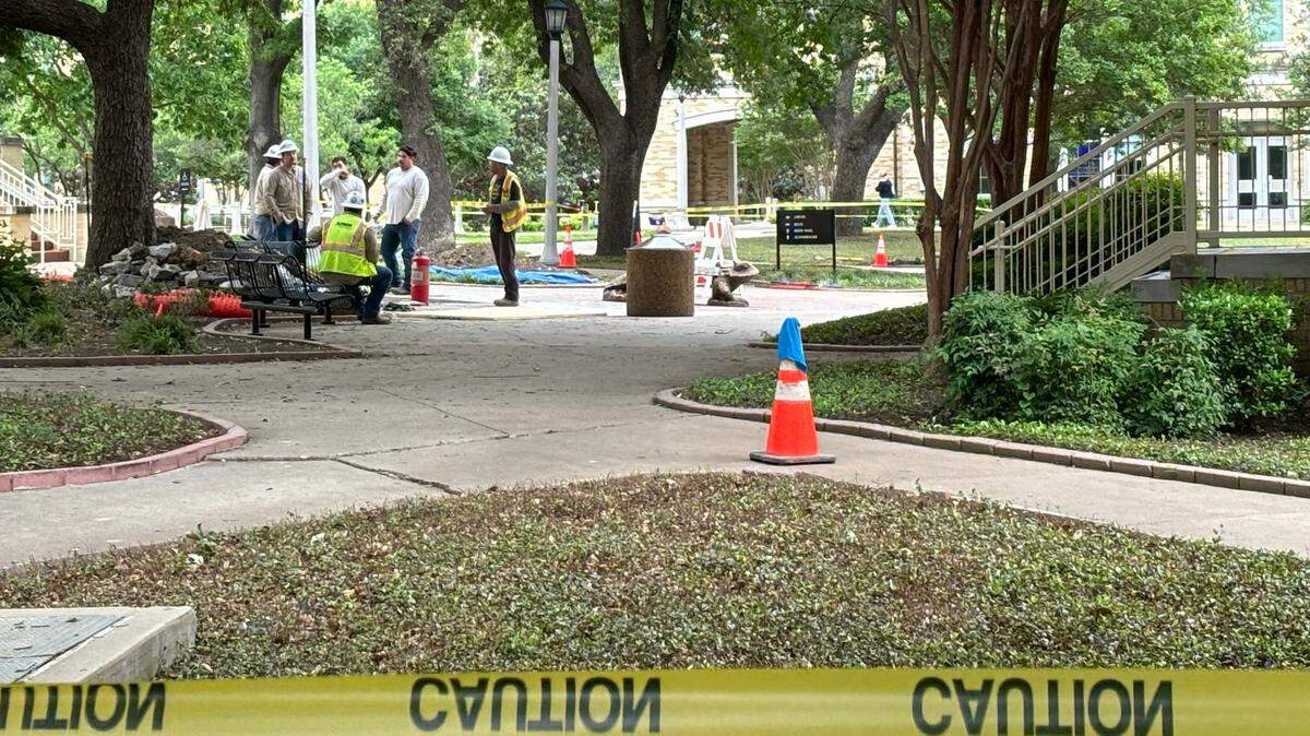 An Atmos Energy crew works on the campus of TCU on Monday, April 15, 2024. The university evacuated several buildings on campus late Monday morning due to a gas leak, according to an emergency alert sent to students and staff.