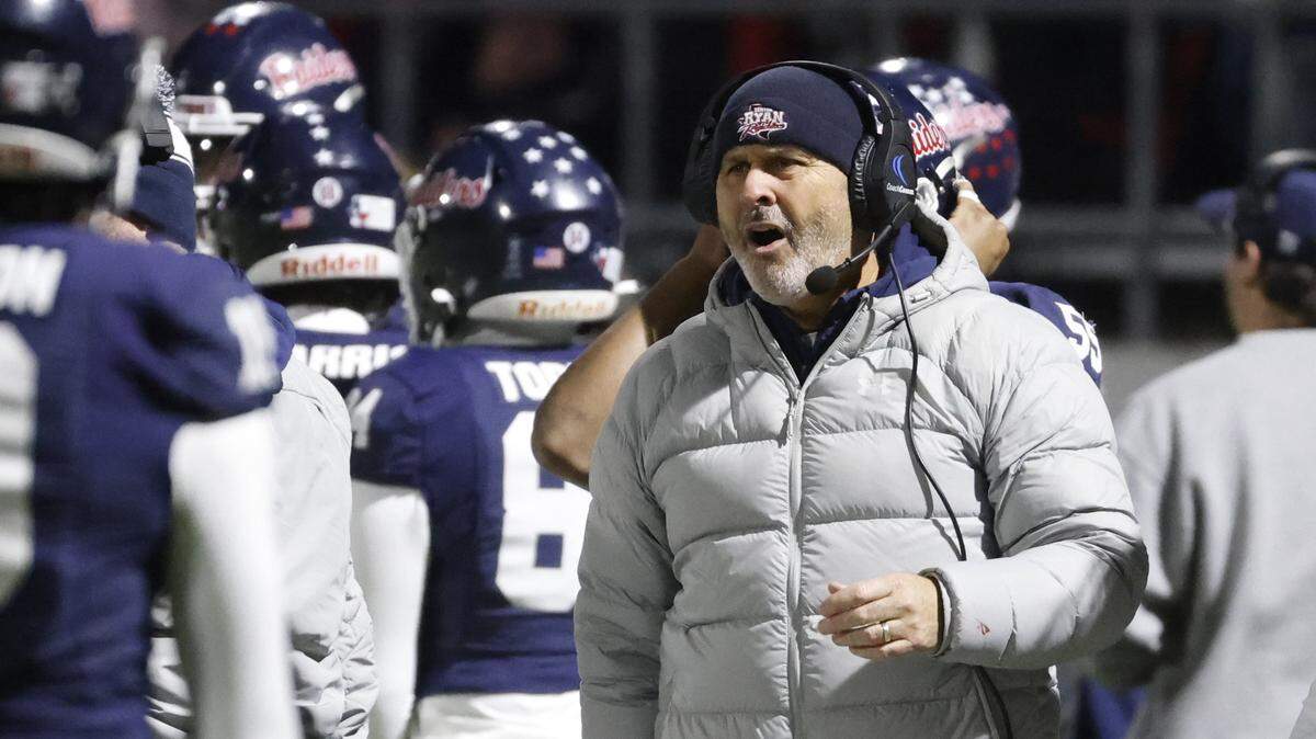Denton Ryan head coach Dave Henigan reacts to a call on the field during the first half against Aledo in a Class 5A Division I state quarterfinal Dec. 5 at Northwest ISD Stadium.