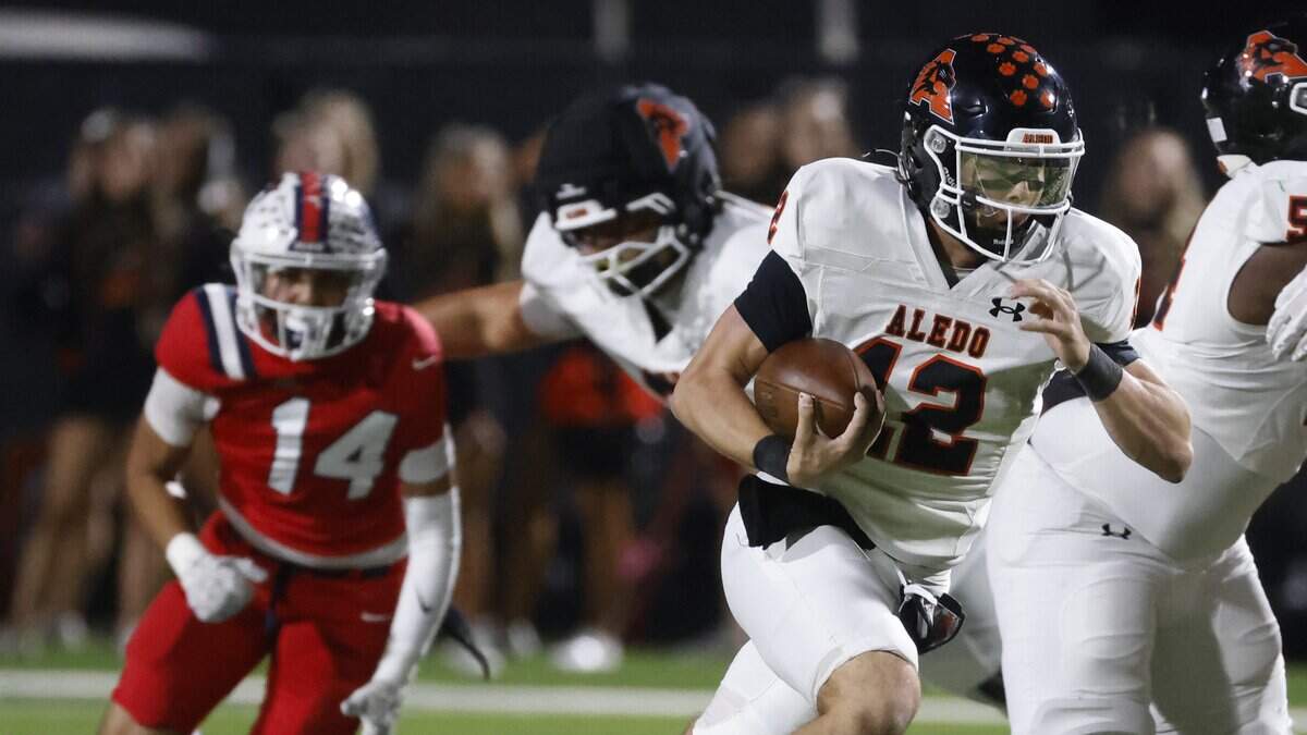 Aledo quarterback Lincoln Tubbs (12) gains 19 yards up the middle during the first half of a UIL football game against North Richland Hills Richland on Thursday, October, 23, 2025 at Birdville FAAC Stadium in North Richland Hills, Texas.