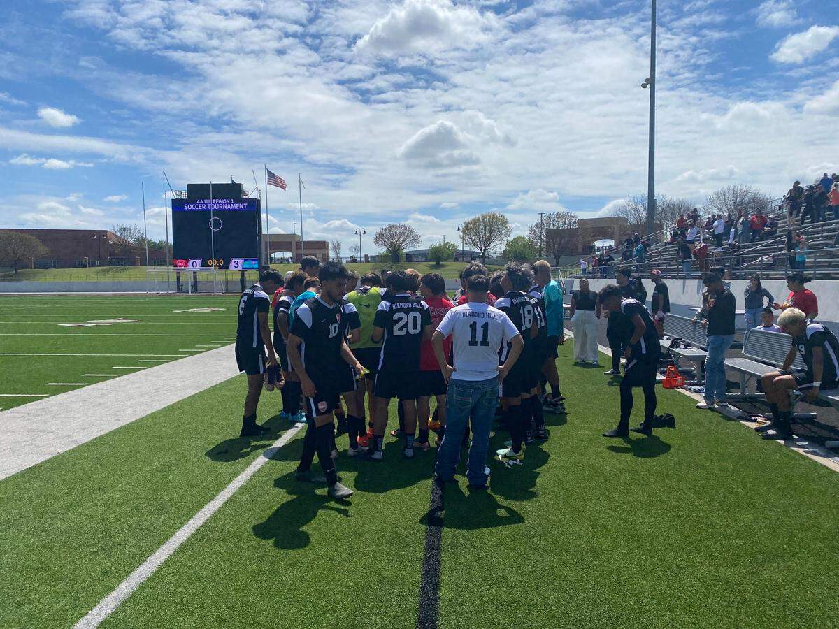 Diamond Jarvis-Hill head coach speaking to his team after their 3-0 loss to San Elizario in the UIL Final