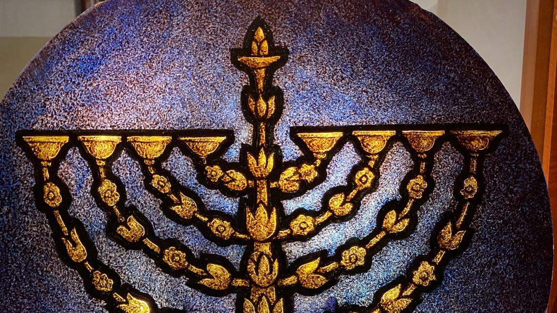 The Hanukkah menorah, with arms resembling branches of a flowering bush, was designed in Frankfurt, Germany, around 1700.