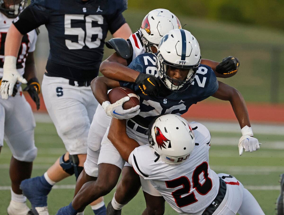 All Saints running back Allen Brown (26) gains four yards on a carry at All Saints High School’s McNair Stadium in Fort Worth Thursday, Sept. 12, 2024.