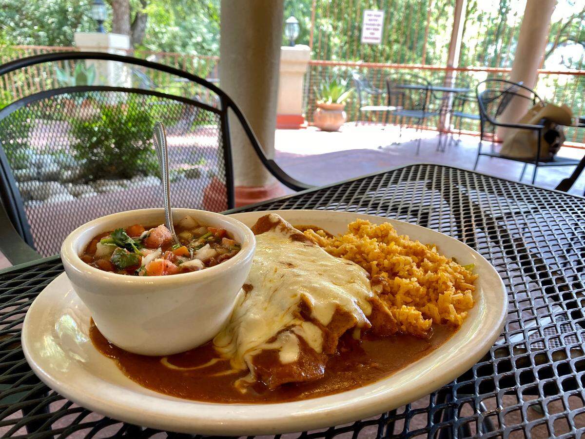 “Old fashioned” enchiladas in chile gravy at Pulido’s, in “El Jardin” alongside the Benbrook location.