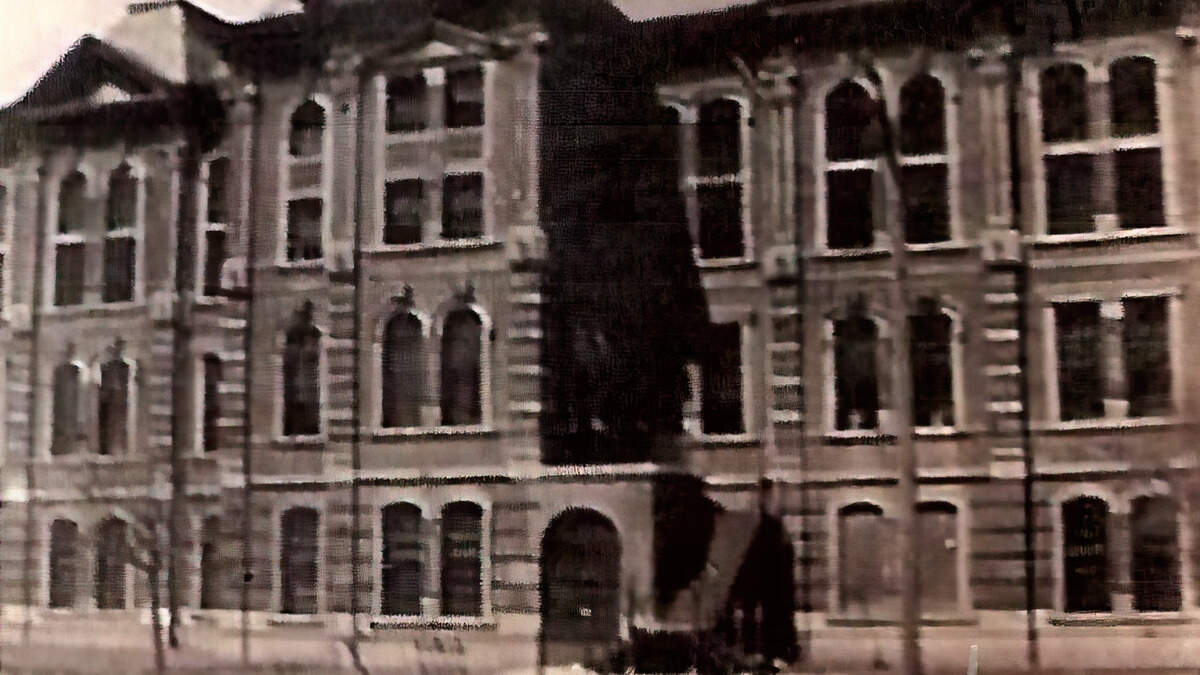 The uncompleted Tarrant County Jail on Belknap Street., circa 1884. Steps added later.