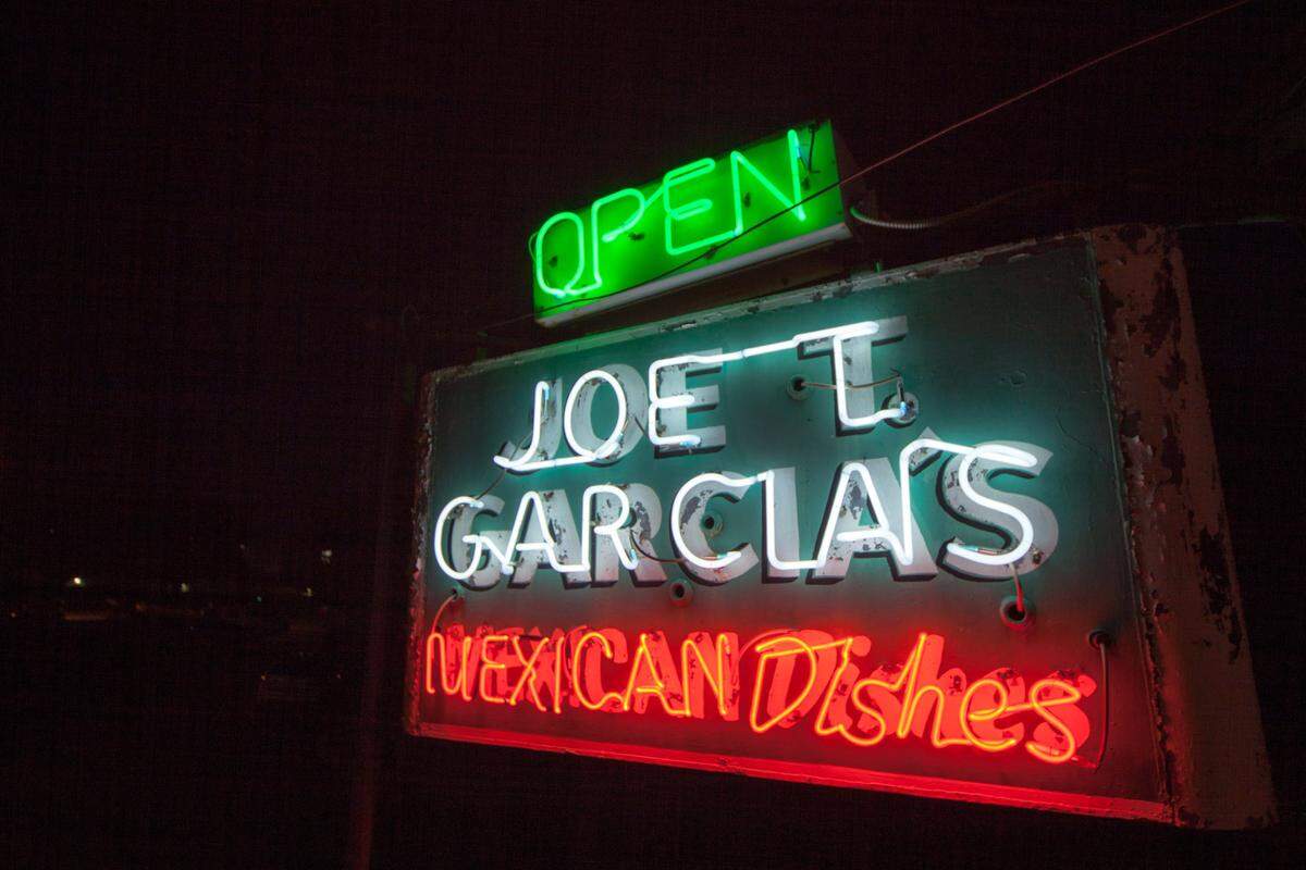 The original sign from Joe T. Garcia’s restaurant, which opened as a 16-seat Mexican and barbecue spot in 1935, still shines bright on n Fort Worth’s north side. It has been painted a few times though, says Lanny Lancarte.