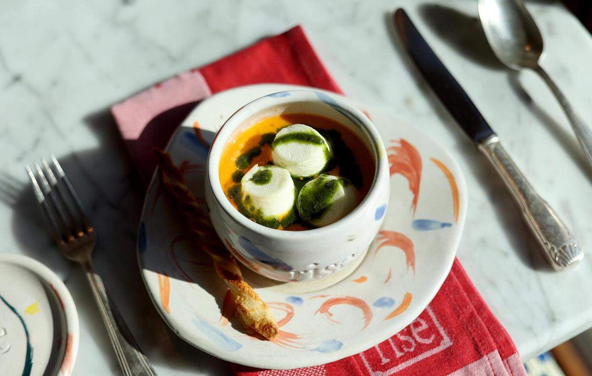 The marshmallow soup at Rise Souffle is a carrot and tomato bisque with goat cheese marshmallows.