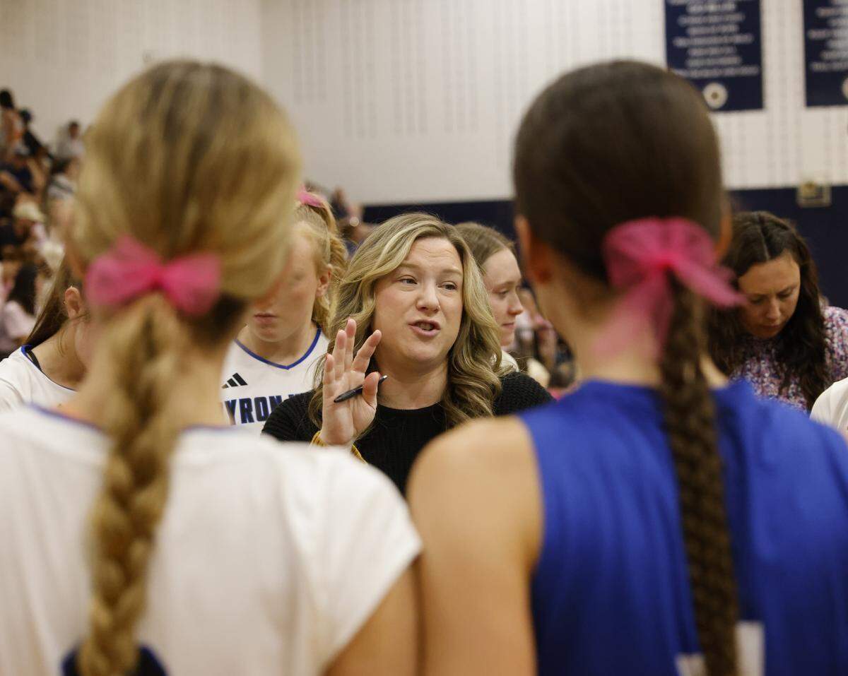 Byron Nelson head coach Brianne Groth talks to the team before the second set against Keller on Oct. 14. “People probably don’t understand the amount of pressure that these kids are under,” Groth said.&nbsp;