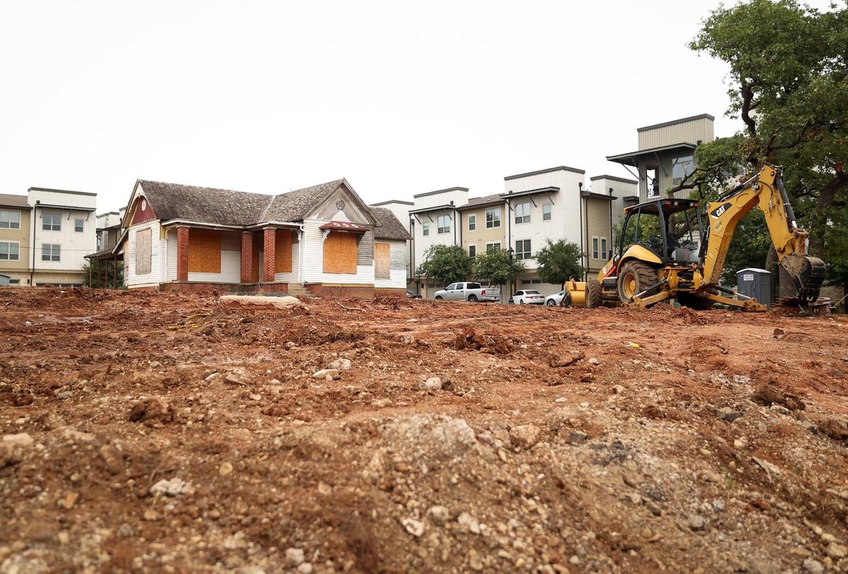 What remains of the late 19th century Reilly-Lehane house, surrounded by new apartments. The city is weighing the demolition of the historic home to allow more residential development.