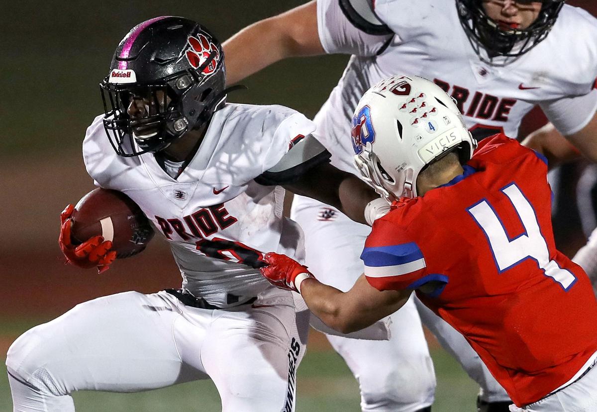 Colleyville Heritage running back Isaac Shabay (3) is stopped by Grapevine defensive back Jack Turner (4) during the first haif, Friday night, October 25, 2019 played at Mustang-Panther Stadium in Grapevine, TX.