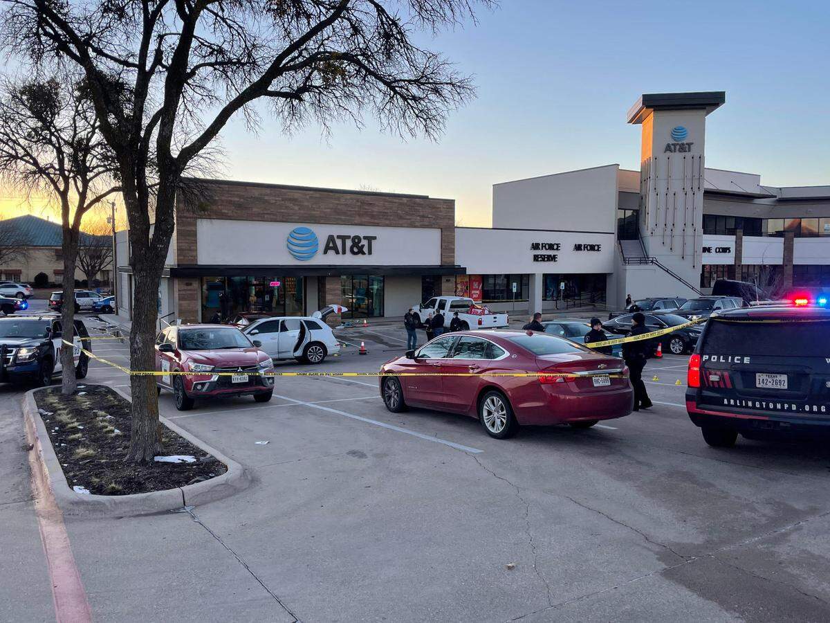 Police in Arlington investigate a shooting in the parking lot at Arlington Town Center in which a man was killed on Feb. 5, 2022.