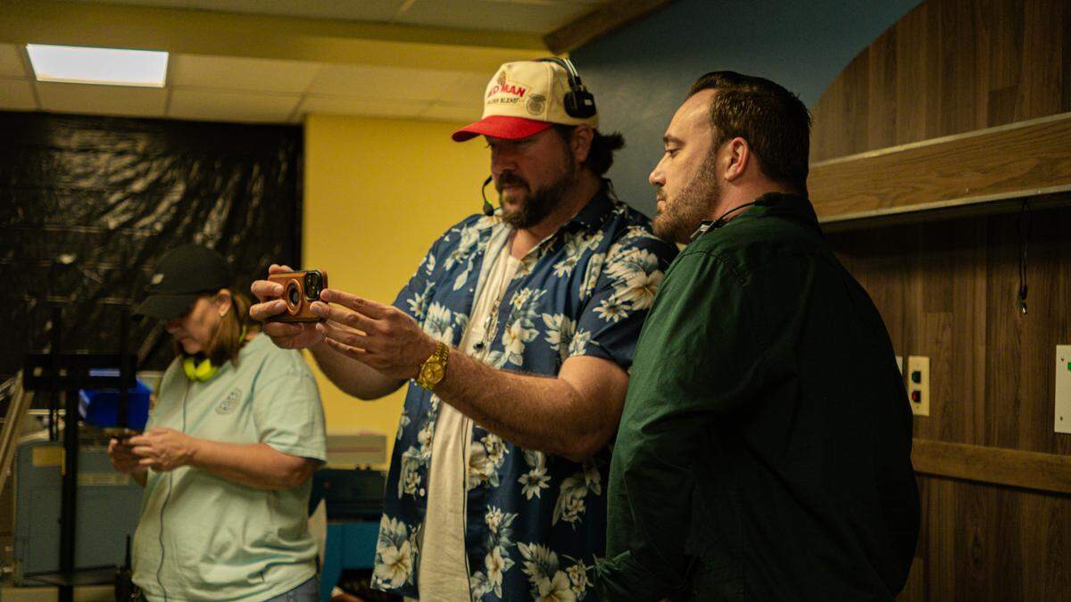 Tanner Beard (center) on set.
