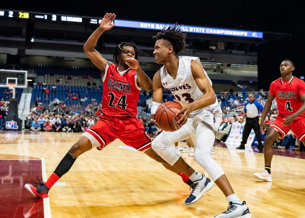 Mansfield Timberview’s Trazarien White (right) drives against Wagner’s Journee Phillips, Saturday March 9, 2019