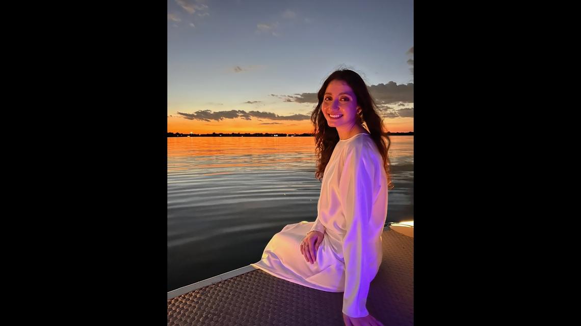 Ward Sakeik, a Palestinian refugee who lives in North Texas, poses in front of an ocean sunset.