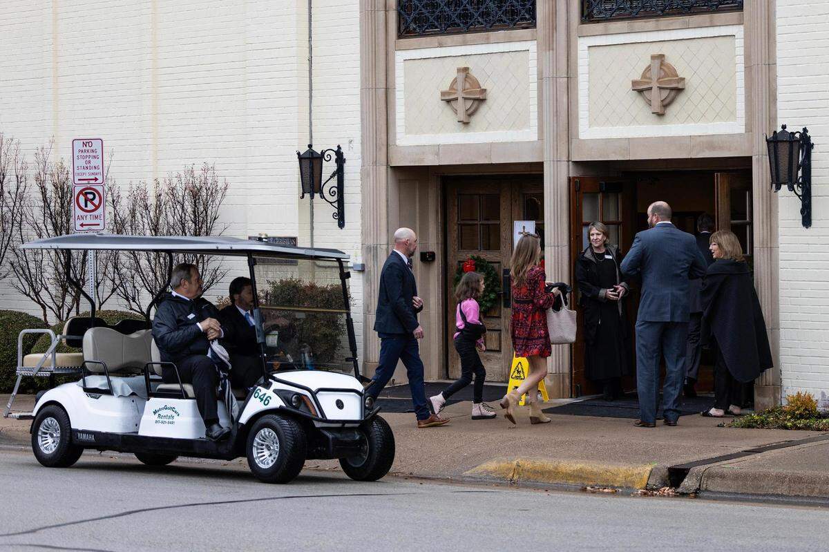 Mourners enter the church for the Muckleroy family funeral service at University Christian Church in Fort Worth on Friday.