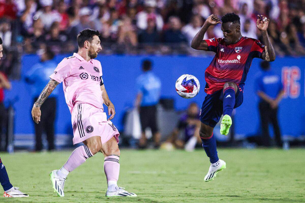 Inter Miami CF captain Lionel Messi (10) goes for a ball against FC Dallas defender Jadér Obrian (8) in the first half during a Leagues Cup match at TOYOTA Stadium in Frisco, Texas on Sunday, Aug. 6, 2023.