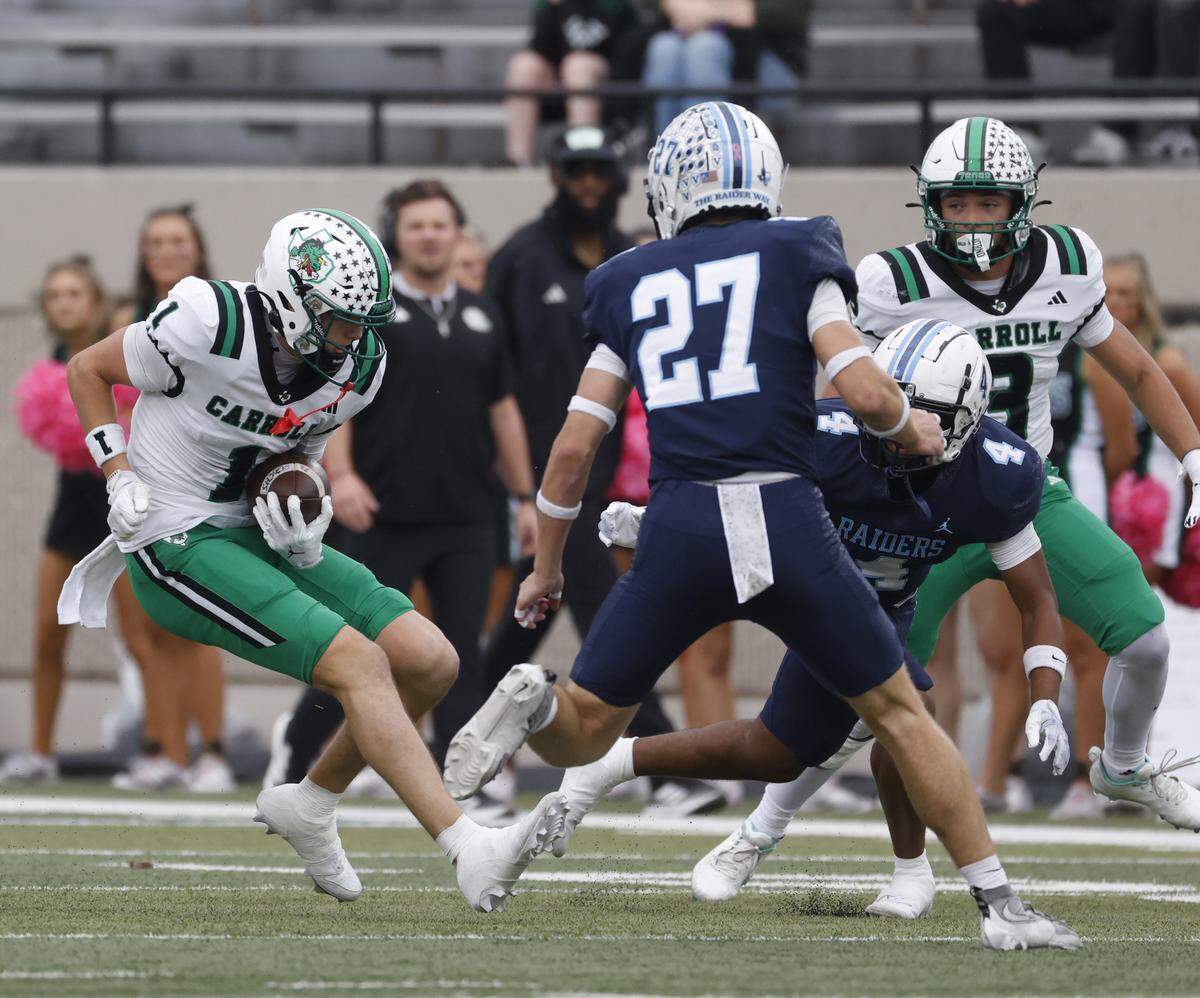 Southlake wide receiver Brock Boyd (1) puts on the braked but is tackled by L.D. Bell defensive back Caden Digiulio (27) during the first half of a UIL football game between Carroll and L.D. Bell at Pennington Field in Bedford, Texas, Friday, October, 24, 2025.