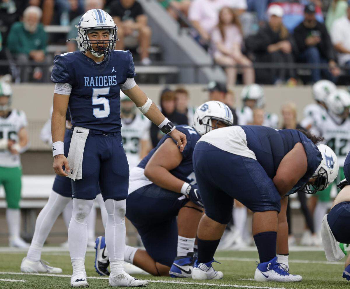 L.D. Bell quarterback Braelon Harris (5) checks the sidelines for the play call during the first half of a UIL football game between Carroll and L.D. Bell at Pennington Field in Bedford, Texas, Friday, October, 24, 2025.