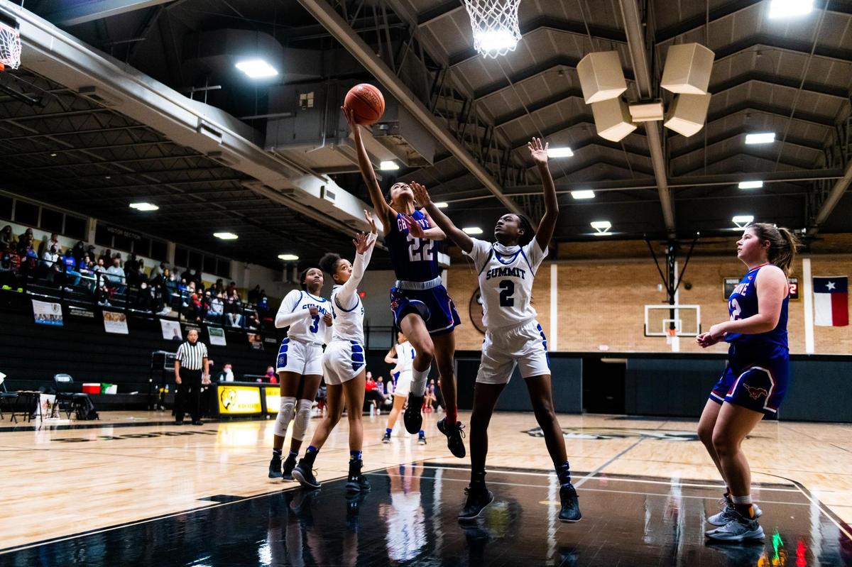 Kennadi Archibald (22) drives to the basket during an Area round playoff game between Grapevine and Mansfield Summit at Irving High Shcool on February 20, 2021. Photo by Matt Smith (Special to the Star-Telegram).