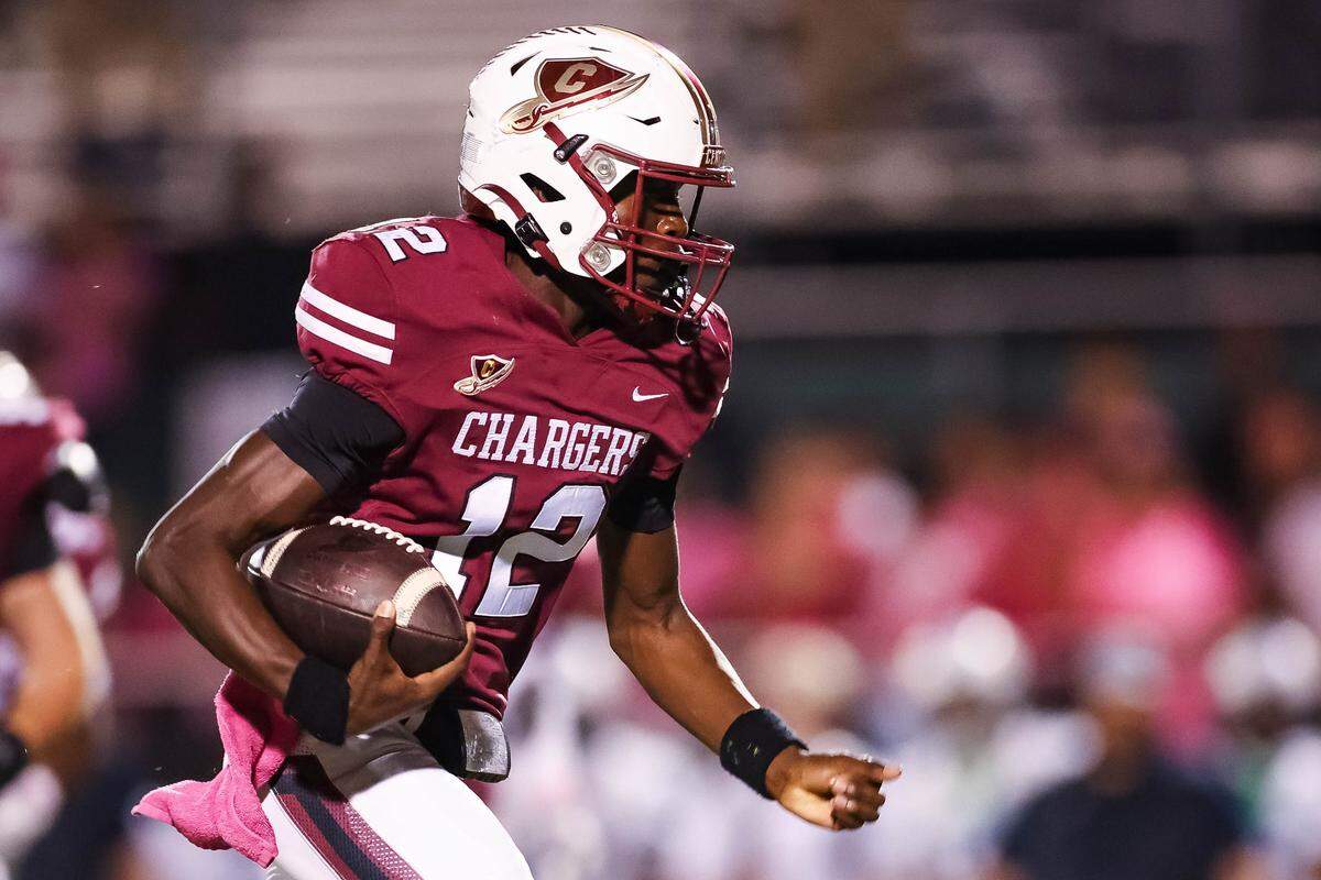 Keller Central quarterback Isaiah Taylor runs with the football toward the endzone during a district game between Keller Central and L.D. Bell at Keller ISD Stadium in Keller, Texas on October 16, 2025.