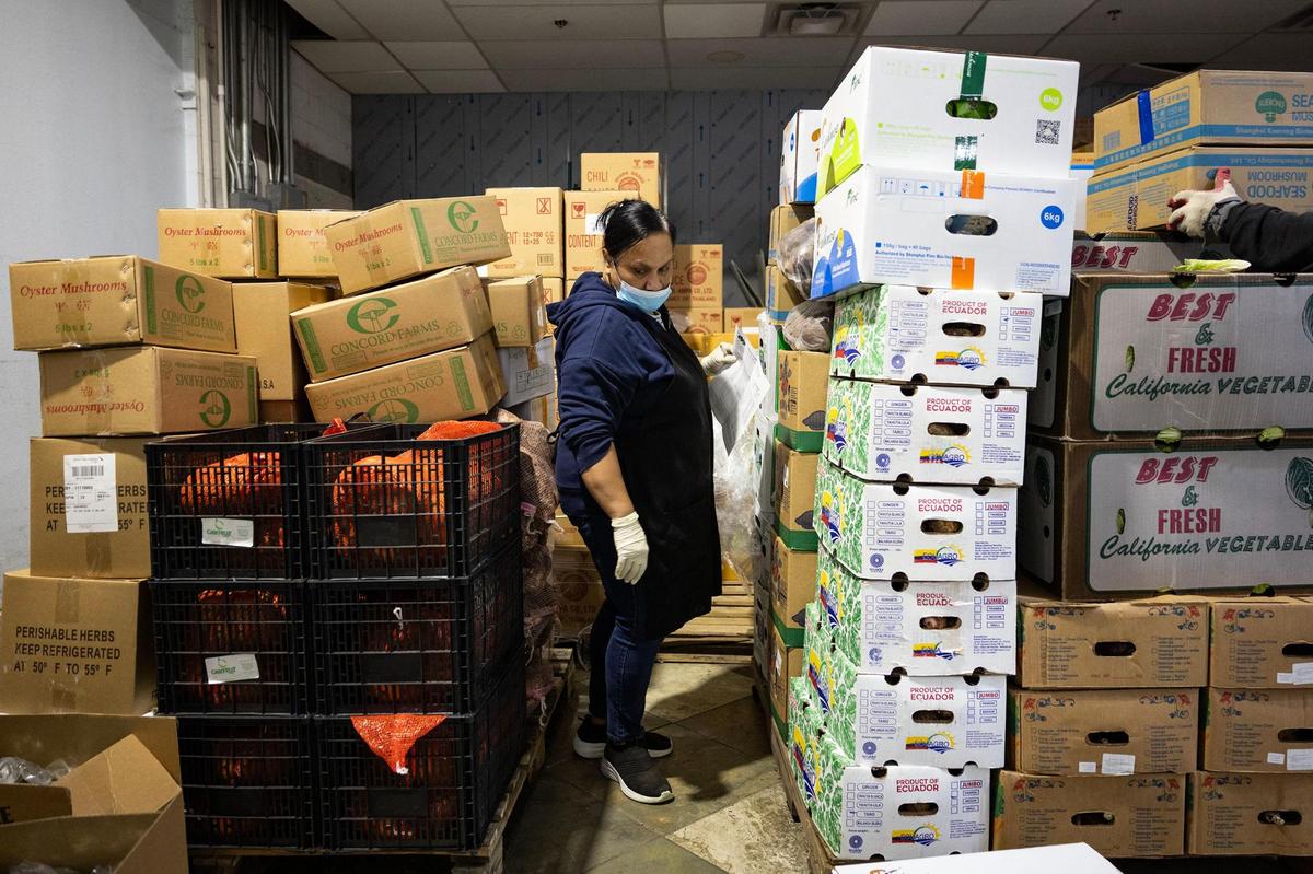 Produce worker Naioko Mathias checks the produce inventory at Nguyen Loi Oriental Supermarket in Haltom City on Thursday, May 8, 2025.
