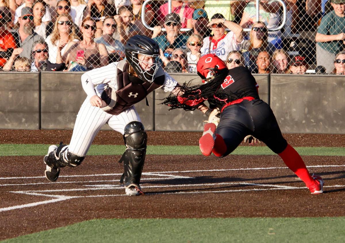 Aledo catcher Austyn Marriage (4) gets Melissa center fielder Finlee Williams (2) at home during the UIL softball state semifinals 5A D1 playoff game at Trojan Softball Field in Euless, Texas, Wednesday, May 21, 2025.