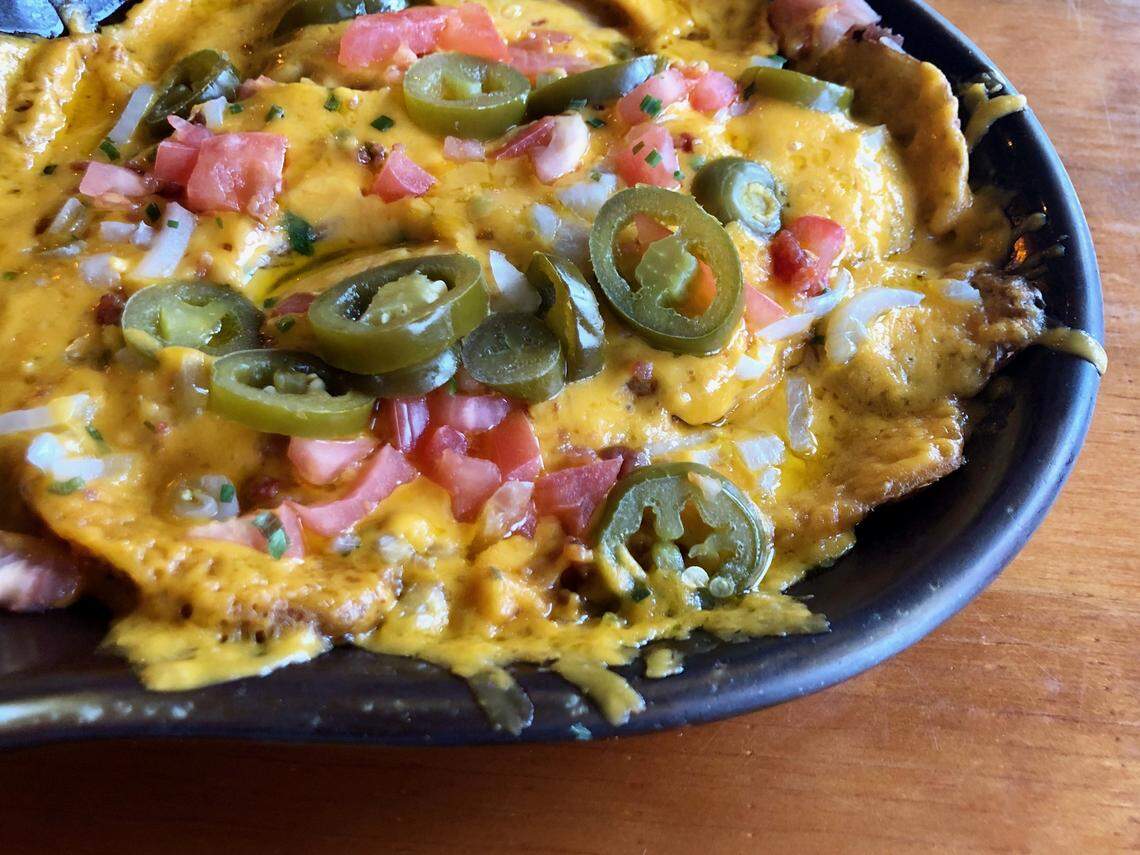 J. Gilligan’s Bar & Grill in Arlington popularized “Irish nachos” served on cottage fries instead of chips.