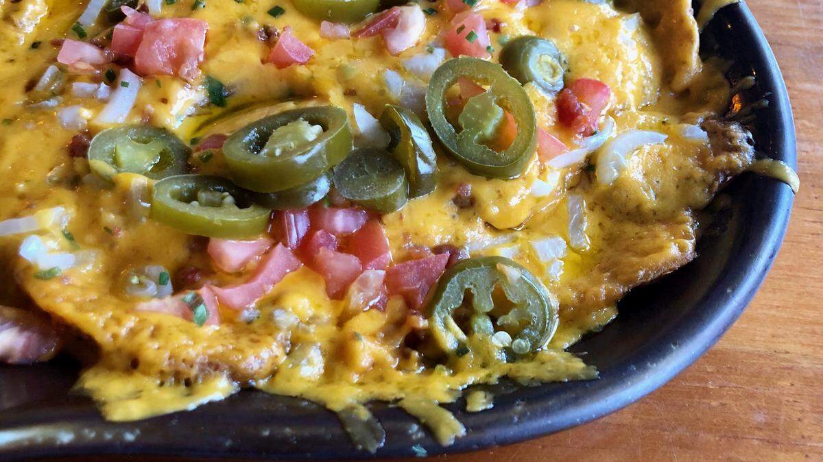 J. Gilligan’s Bar & Grill in Arlington popularized “Irish nachos” served on cottage fries instead of chips.
