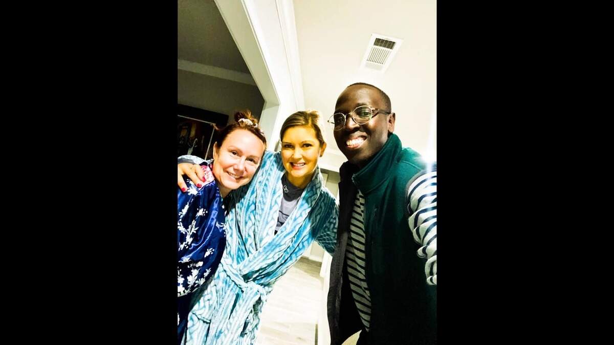 April Heileman (center) poses for a photo with two friends. Her skin has taken on a yellow tone in recent months, a tell-tale sign of liver damage, as doctors say she needs a liver transplant or she could have three months to live.