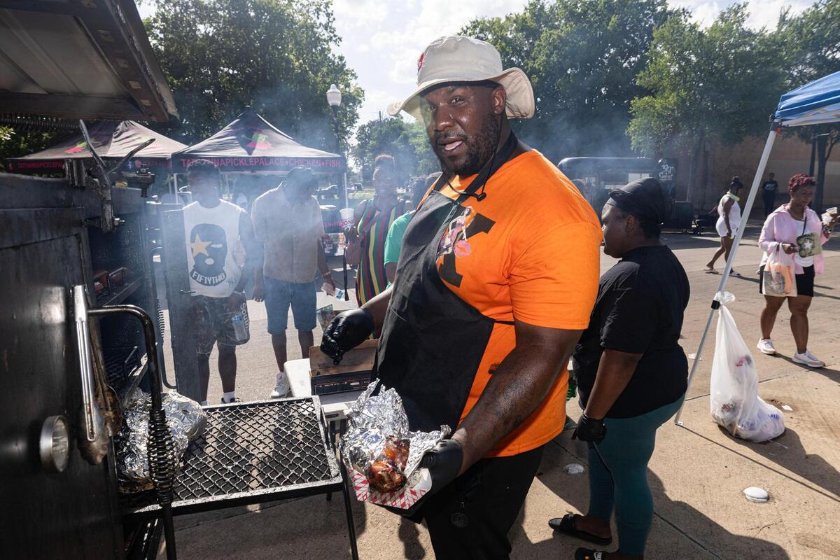 Allen Washington of Ali Turkey Legs DFW prepares an order of turkey legs during the Freedom Vibes Juneteenth Block Party in Fort Worth on Saturday, June 21, 2025.