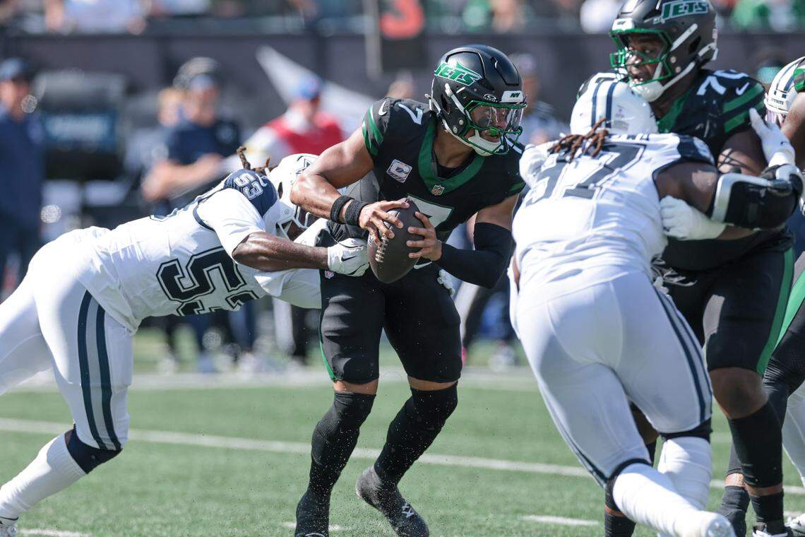 Oct 5, 2025; East Rutherford, New Jersey, USA; New York Jets quarterback Justin Fields (7) is sacked by Dallas Cowboys defensive end James Houston (53) during the first half at MetLife Stadium. Mandatory Credit: Vincent Carchietta-Imagn Images