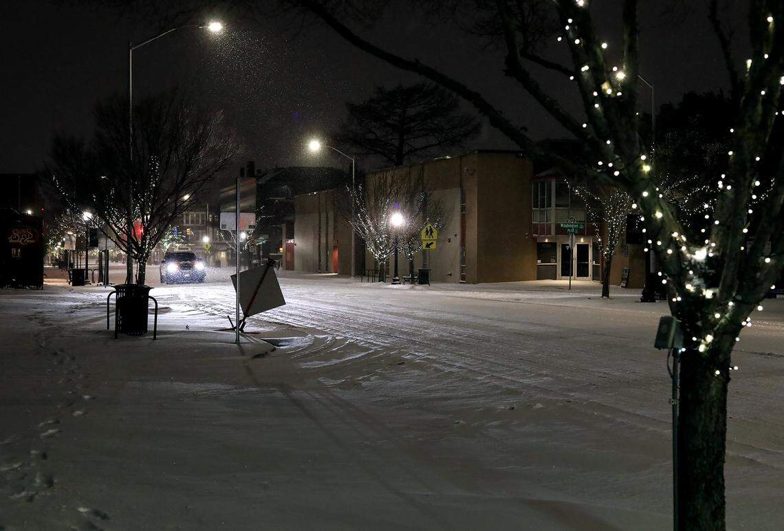 A vehicle drives on Magnolia Avenue on Feb. 14, 2021, in Fort Worth. ERCOT, which oversees Texas’ electric grind, began rotating outages early Monday Feb. 15, 2021 to reduce the demand on energy as Texans try to keep warm.