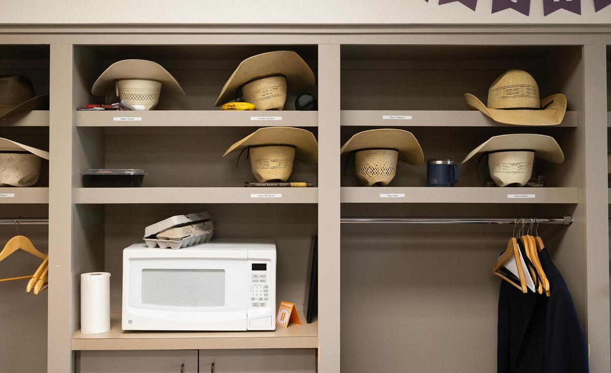 Cowboy hats rest in student cubbies at the Ranch Management program building at TCU.