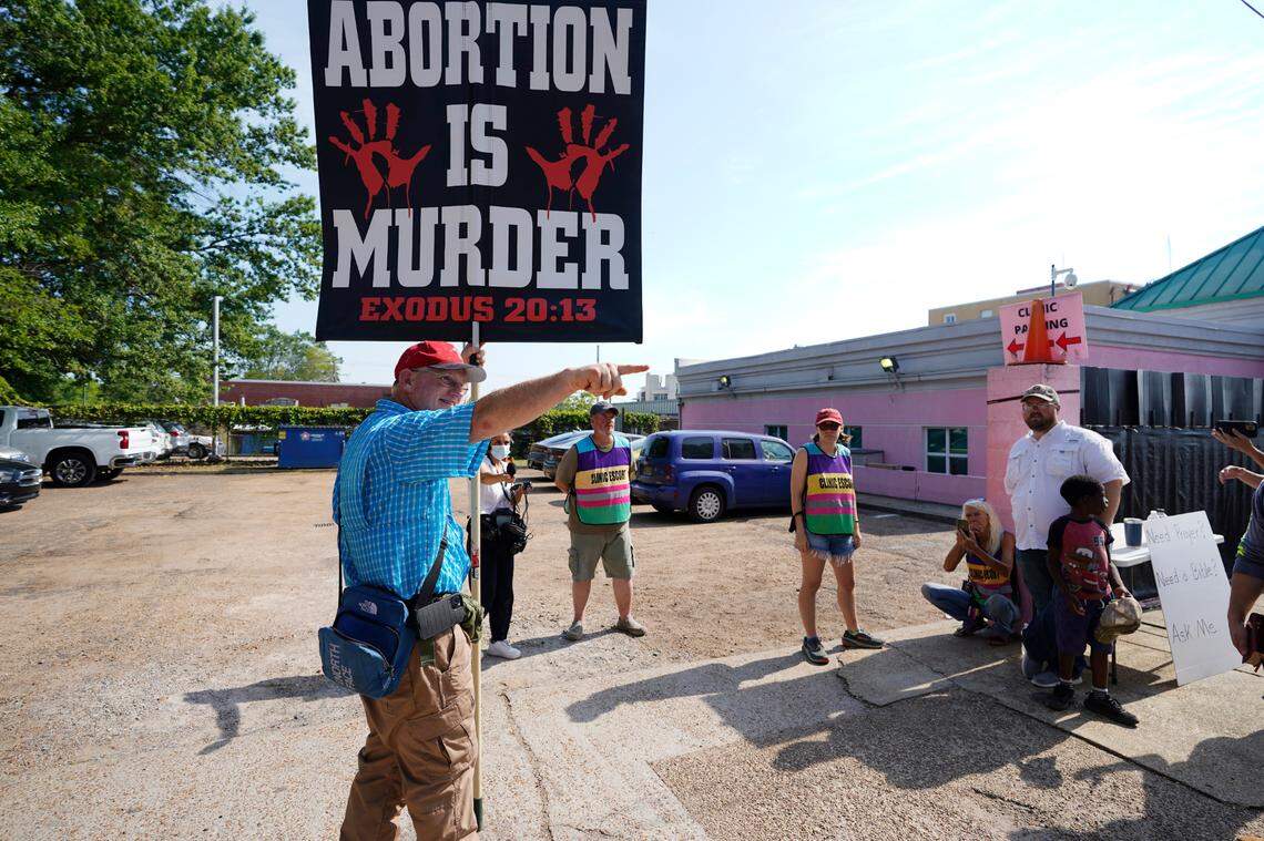 Anti-abortion activist Coleman Boyd calls out to a friend as he protests outside the Jackson, Mississippi, Women’s Health Organization clinic June 23, 2022. The clinic was the only medical facility that performed abortions in Mississippi while the state awaited a U.S. Supreme Court ruling on the state’s ban on most abortions after the 15th week, that could result in a reversal of Roe v. Wade.