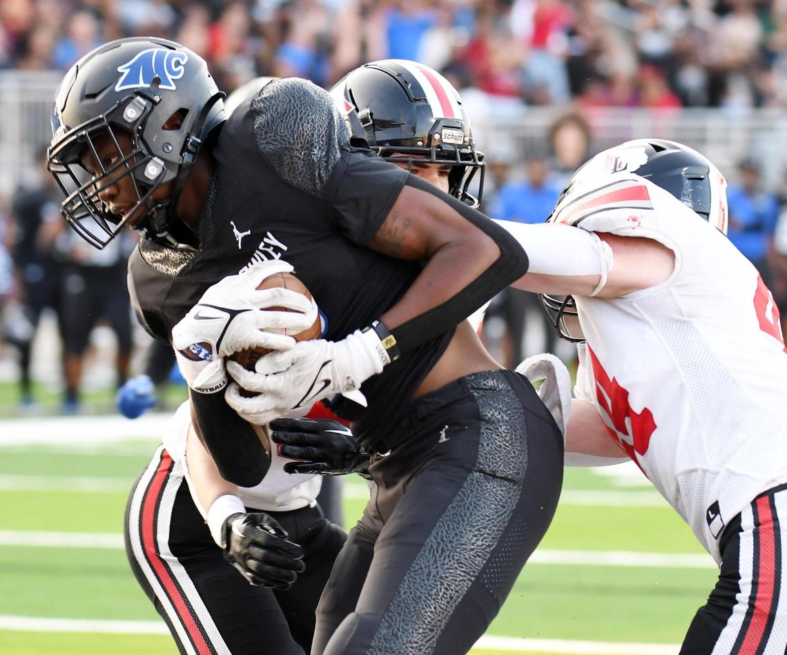 North Crowley’s Kamorreun Pimpton, left, makes the catch between Lovejoy’s Avery Fuller and Bennett Slaughter for the touchdown to take a 6-0 lead in the first quarter of Thursday’s September 8, 2022 football game at Crowley ISD Stadium in Fort Worth, Texas. Special/Bob Haynes