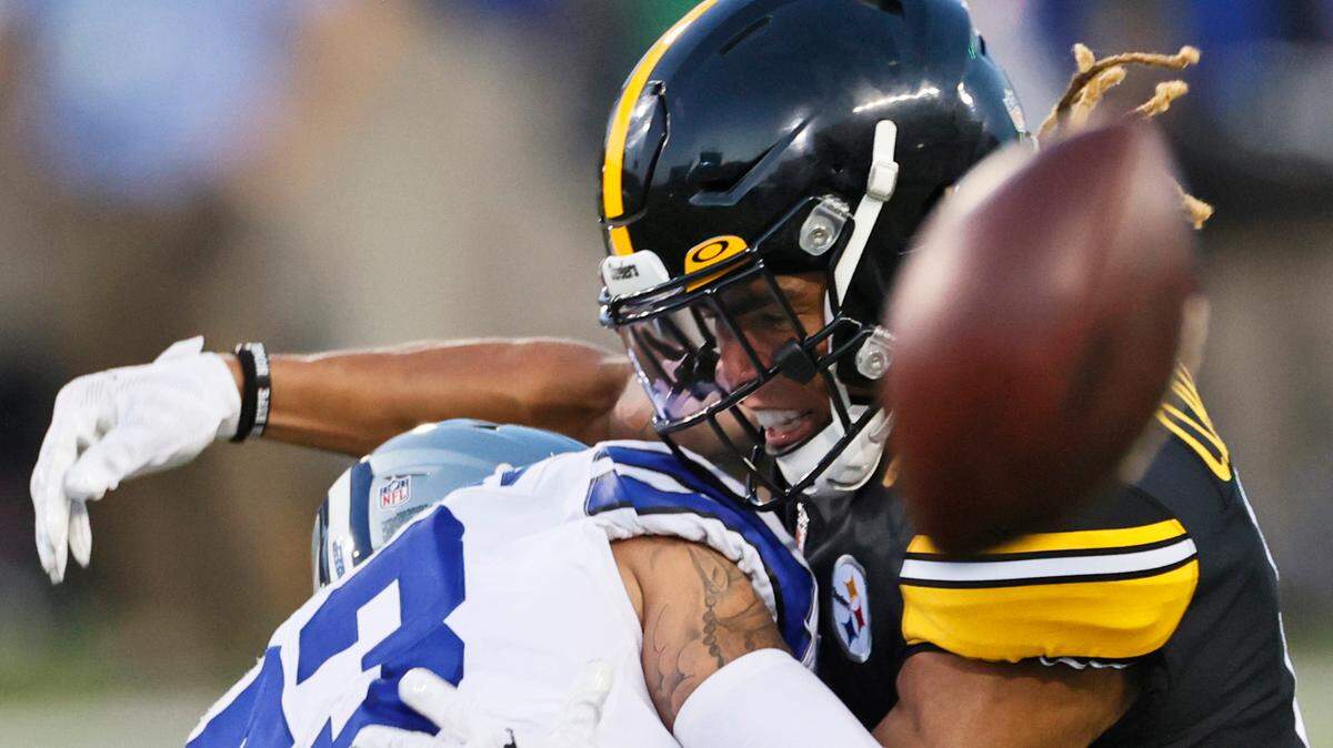 Dallas Cowboys defensive back Darian Thompson (23), shown breaking up a pass intended for Pittsburgh Steelers wide receiver Chase Claypool (11), in 2021, is now on the coaching staff.
