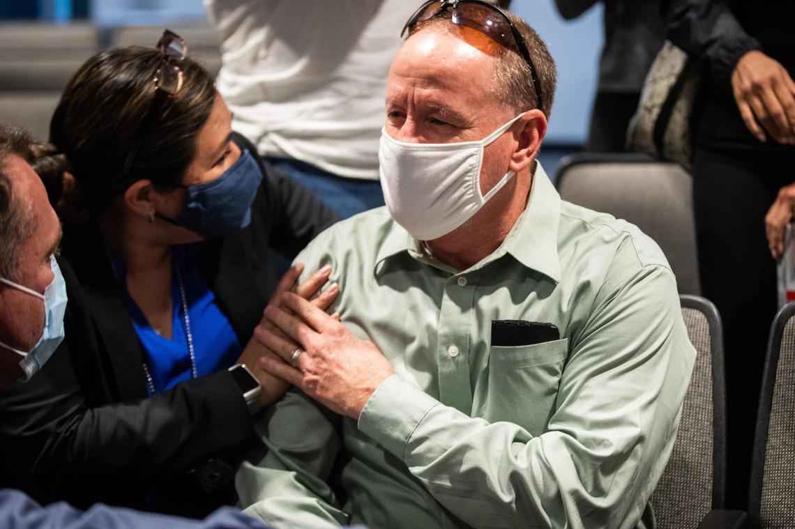 Detective Leah Wagner, who helped make an arrest in the 1974 cold case killing of Carla Walker, hugs Jim Walker, Carla Walker’s brother, after the press conference Tuesday, Sept. 22, 2020, in Fort Worth.