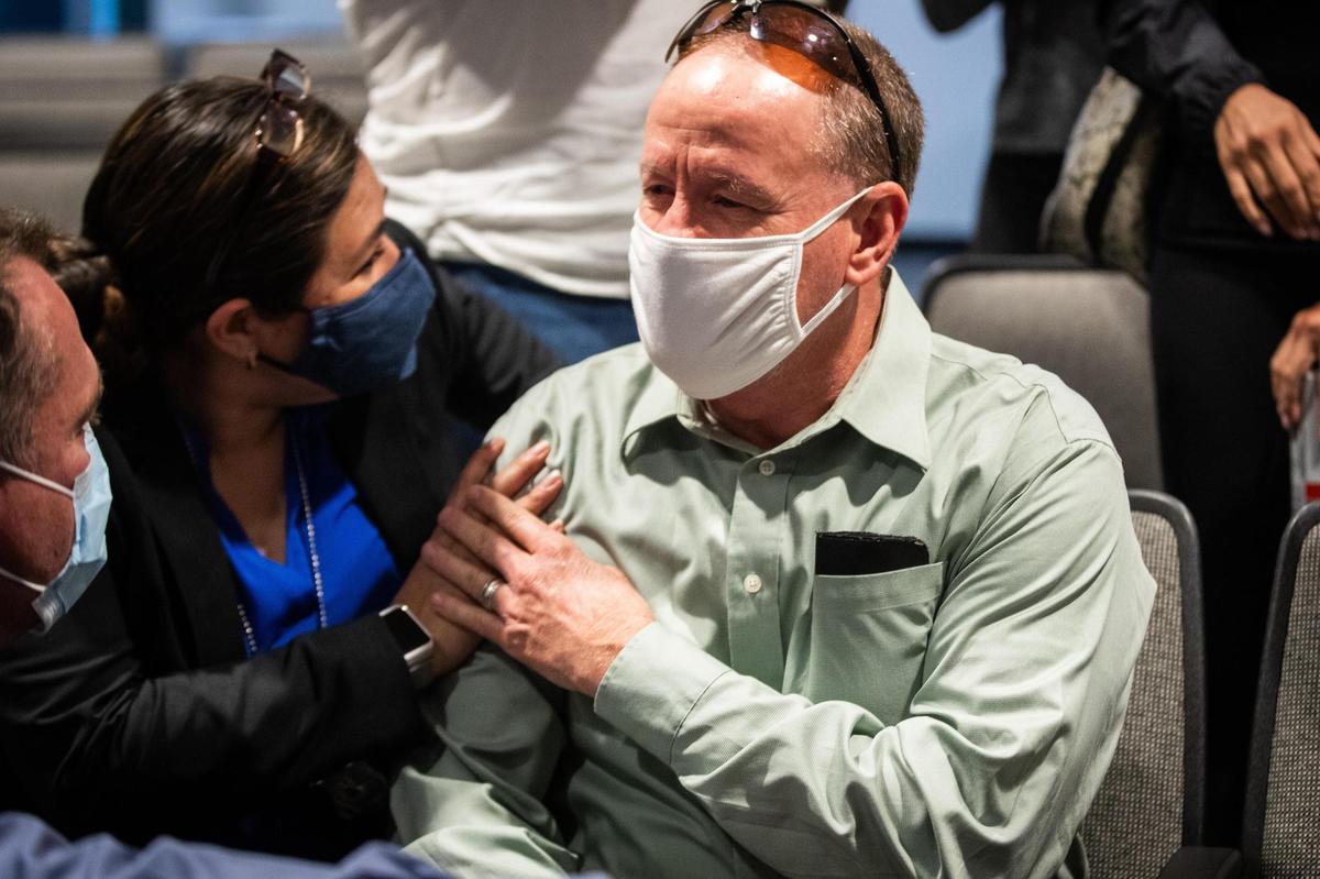 Detective Leah Wagner, who helped make an arrest in the 1974 cold case killing of Carla Walker, hugs Jim Walker, Carla Walker’s brother, after the press conference Tuesday, Sept. 22, 2020, in Fort Worth.