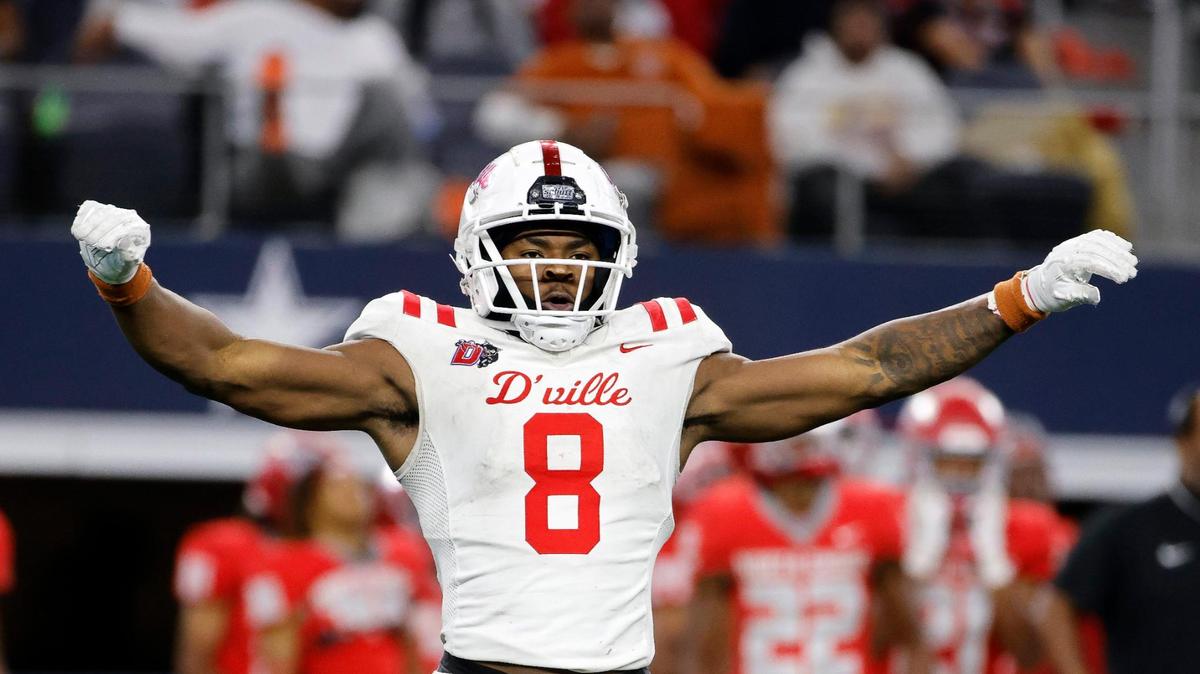 Duncanville defensive end Colin Simmons (8) celebrates a fumble recovery during the second half of the UIL Conference 6A Division 1 state championship football game at AT&T Stadium in Arlington, Texas, Saturday, Dec. 16, 2023.