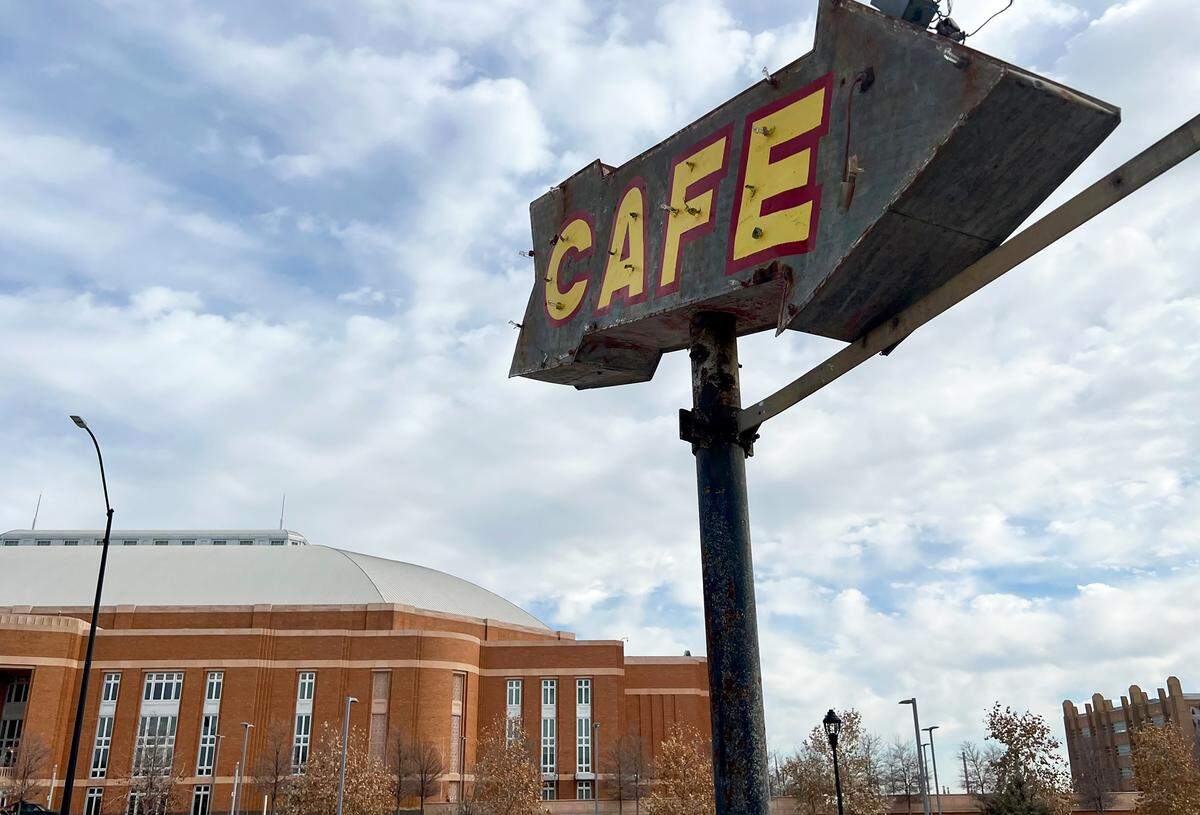 The old-timey neon “cafe” arrow points to Montgomery Street Cafe across from Dickies Arena on Jan. 7, 2023.