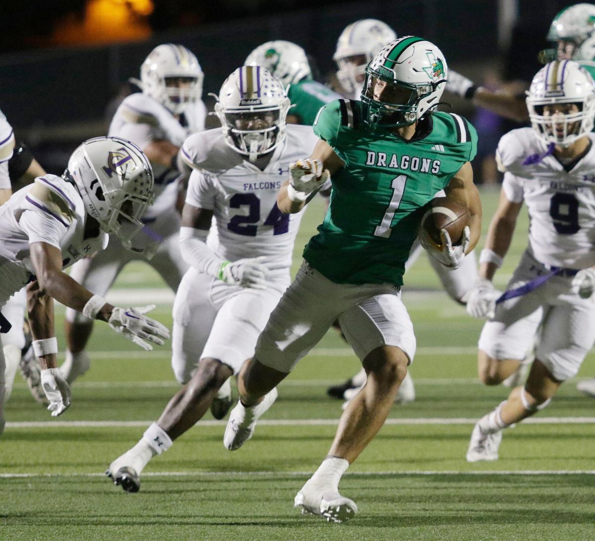 Southlake Carroll’s Riley Wormley escapes a tackle and scores during a UIL football game at Dragon Stadium on Friday, Sept. 27, 2024.