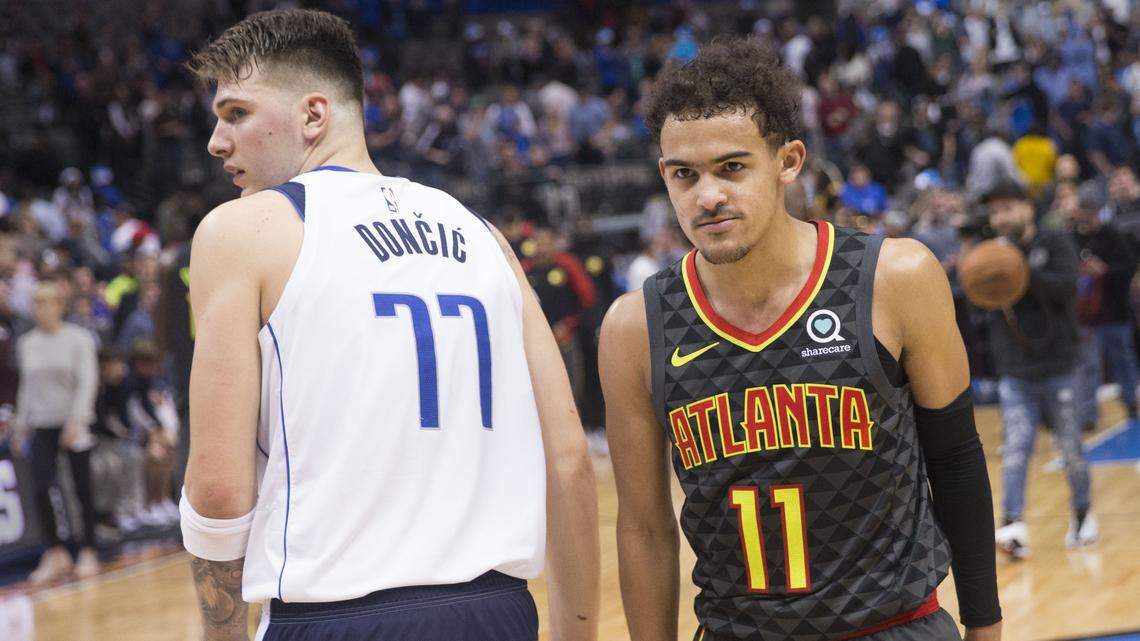 Dallas Mavericks forward Luka Doncic (77) and Atlanta Hawks guard Trae Young (11) after an NBA basketball game at the American Airlines Center in Dallas on Wednesday, Dec. 12, 2018. The Mavericks won, 114-107. (Daniel Carde/The Dallas Morning News/TNS)
