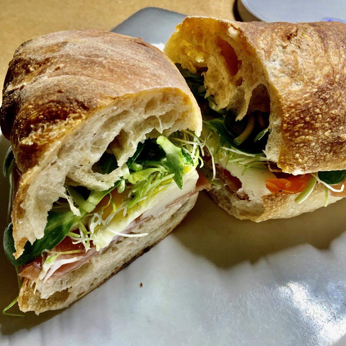 A sprouts-and-hummus sandwich on sourdough at 3rd Street Market.