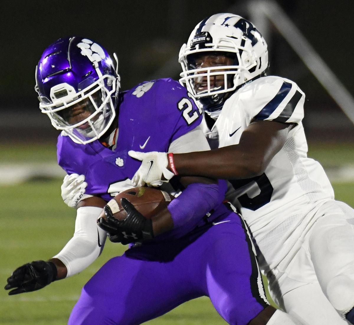 Paschal’s Tommy Bell, left is wrapped up by Richland’s Kendle Arnold after a catch for a small gain in the first quarter of their non-district football game Thursday, October 1, 2020 at Clark Stadium in Fort Worth, Texas. Special/Bob Haynes