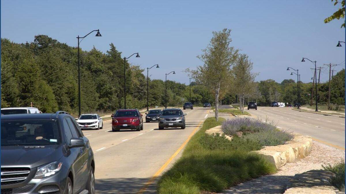 Stone planters, landscaping, and new trees that have been installed along Colleyville Boulevard.