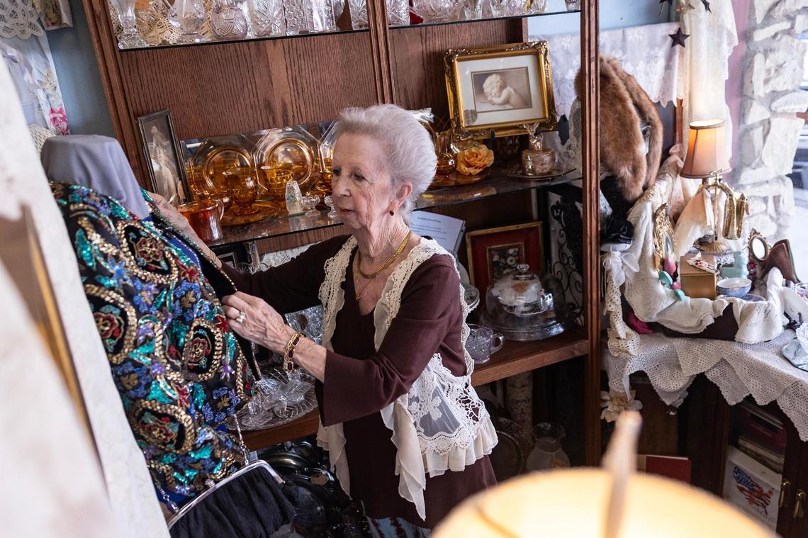 Shirley Leverett organizes her favorite area where she works at the Main Street Mall antique store in Decatur’s courthouse square on March 29. Leverett, who has worked at the antique store for 10 years, said she does not mind the growth of the city, but would like to see more small businesses and less corporate companies.