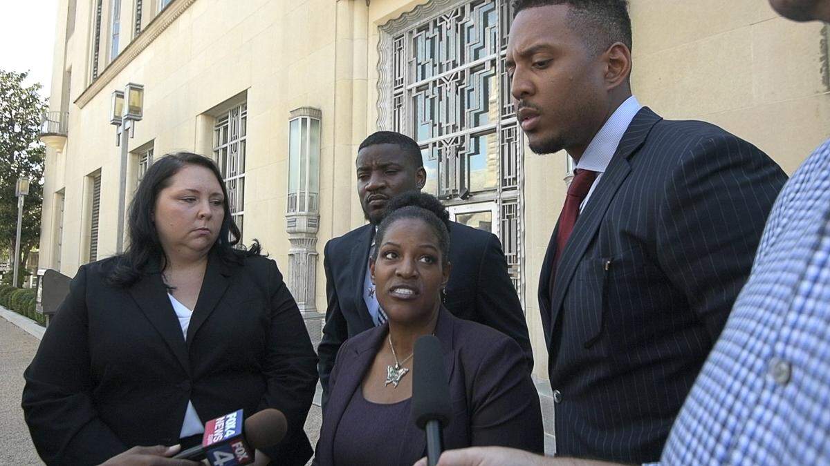 From left: Attorney Alison Grinter, minister Dominique Alexander, attorney Kim T. Cole, and attorney Justin Moore talk to the media after Crystal Mason, 43, who was convicted in state court in March of illegal voting, was sentenced to 10 months in federal prison Thursday for violating the terms of her parole in a fraud case. Mason hearing was at the Eldon B. Mahon U.S. Courthouse in Fort Worth, TX, Thursday, Aug. 30, 2018.  