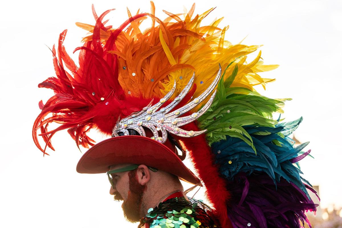 Brent Gobert wears his homemade headdress at the Arlington Pride event at Levitt Pavilion in Arlington on Saturday, June 8, 2024.