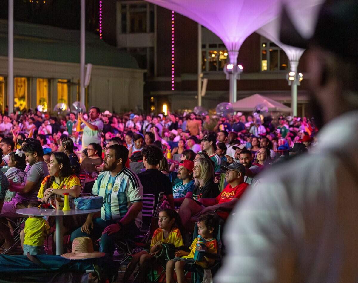 A Fort Worth security guard watches over a crowd of FIFA fans during a Summer of Soccer event at Sundance Square in Fort Worth on June 27, 2026.